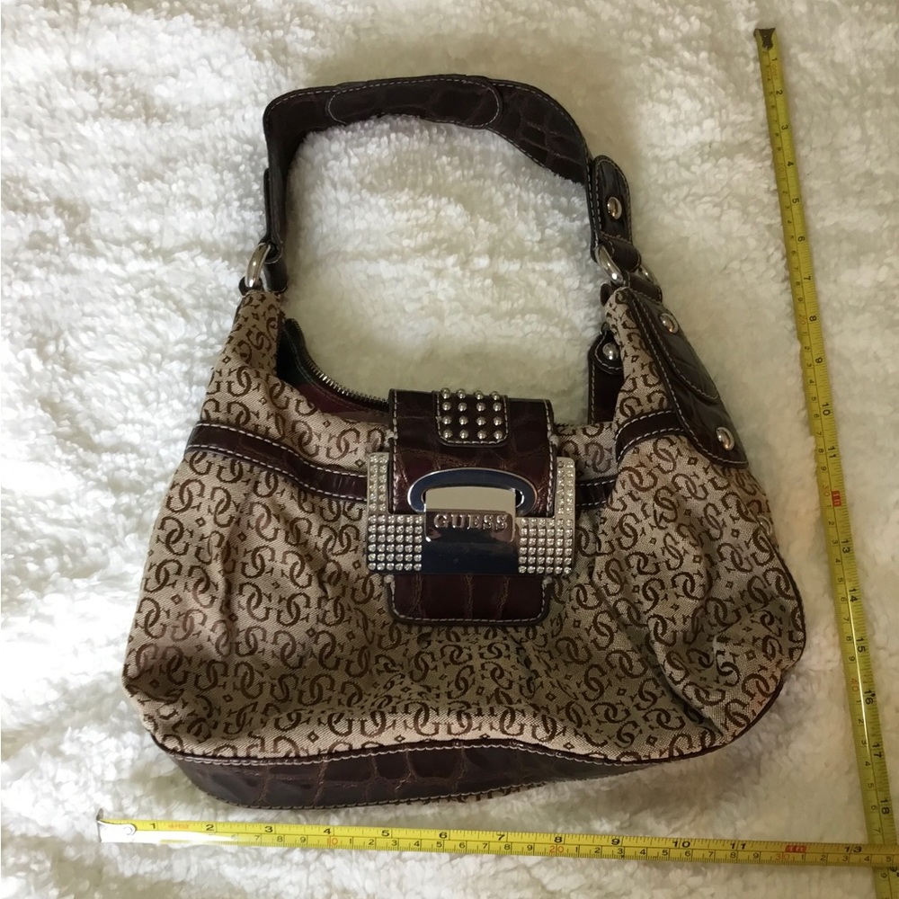 Brown coloured guess handbag.